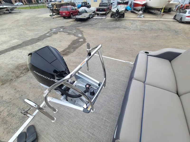 Slide: The Image of 2022 Barletta CORSA 25UC boat with Mercury outboard motor and spacious seating. - 26