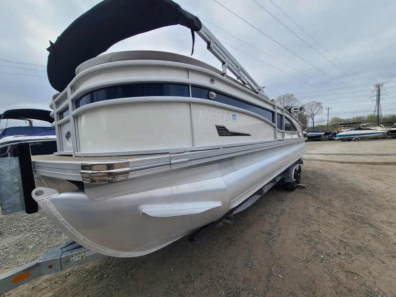 Slide: The Image of 2022 Barletta CORSA 25UC pontoon boat on a trailer. - 3