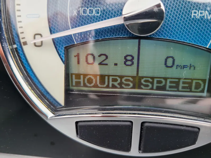 Slide: The Image of Close-up of 2022 Barletta CORSA 25UC boat dashboard showing 102.8 hours and 0 mph. - 33