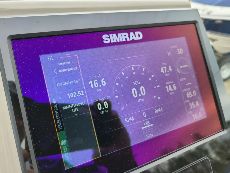 Slide: The Image of Simrad display on 2022 Barletta CORSA 25UC showing engine hours and performance metrics. - 35