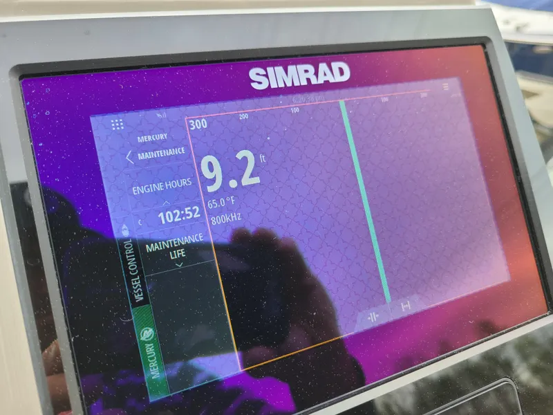 Slide: The Image of Simrad display on 2022 Barletta CORSA 25UC showing engine hours and depth. - 36