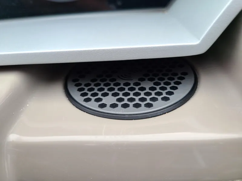 Slide: The Image of Close-up of a speaker grille in a 2022 Barletta CORSA 25UC boat. - 38