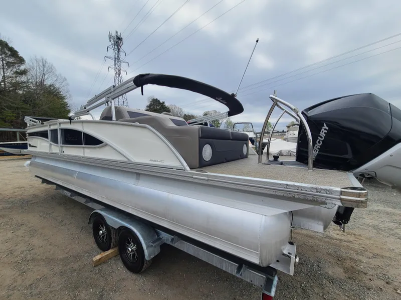 Slide: The Image of 2022 Barletta CORSA 25UC pontoon boat on a trailer, side view. - 4