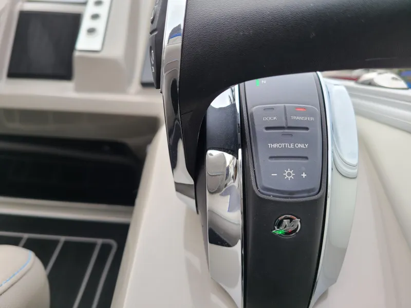 Slide: The Image of Close-up of 2022 Barletta CORSA 25UC boat throttle controls. - 41