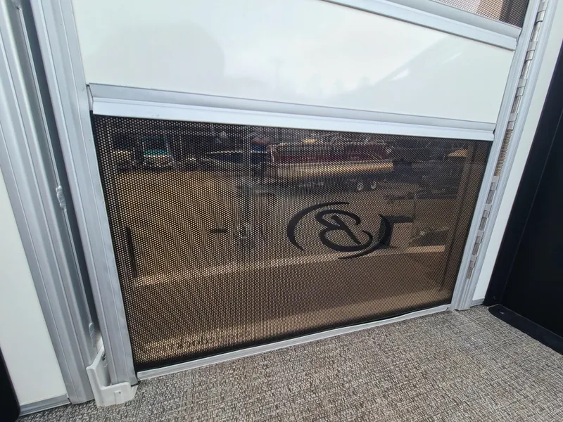 Slide: The Image of 2022 Barletta CORSA 25UC boat interior with mesh panel and logo. - 49