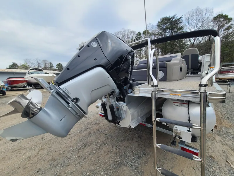 Slide: The Image of 2022 Barletta CORSA 25UC pontoon boat with powerful outboard motor. - 7