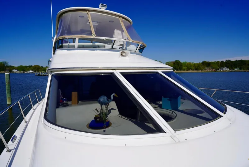 Slide: The Image of 2002 Sea Ray 480 Sedan Bridge yacht on a sunny day. - 16