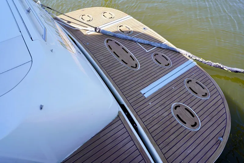 Slide: The Image of 2002 Sea Ray 480 Sedan Bridge swim platform with teak decking. - 26