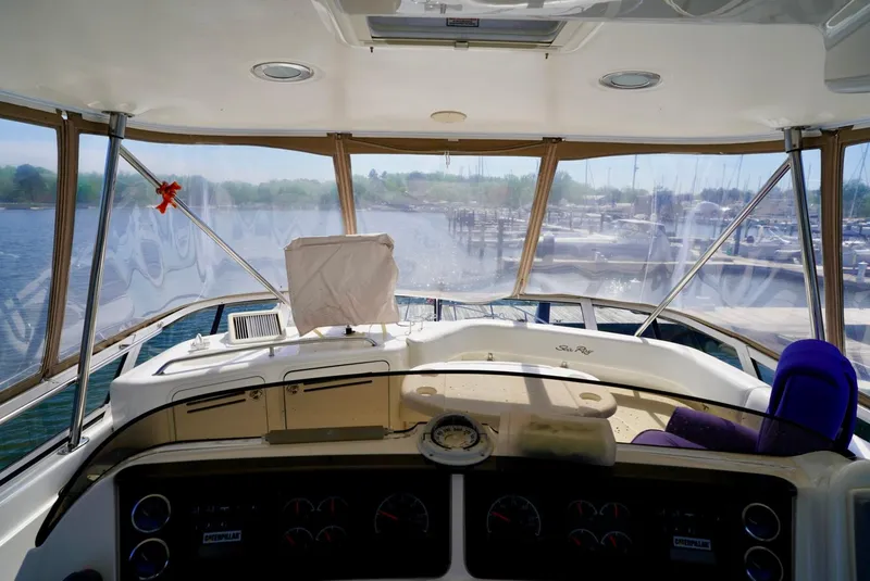 Slide: The Image of Interior view of 2002 Sea Ray 480 Sedan Bridge yacht cockpit. - 31