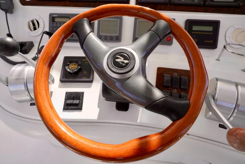 Slide: The Image of Steering wheel and dashboard of a 2002 Sea Ray 480 Sedan Bridge yacht. - 36