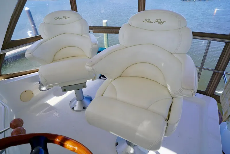 Slide: The Image of Luxurious captain chairs on a 2002 Sea Ray 480 Sedan Bridge yacht. - 39