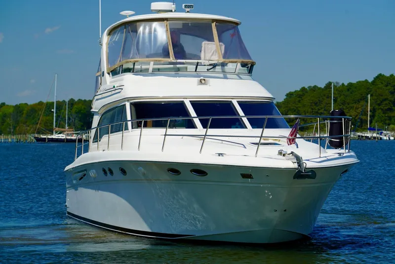 Slide: The Image of 2002 Sea Ray 480 Sedan Bridge yacht on the water. - 4