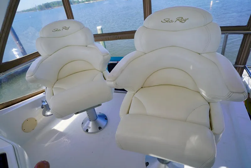 Slide: The Image of Luxurious captain chairs on 2002 Sea Ray 480 Sedan Bridge yacht. - 40