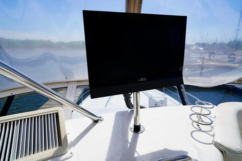 Slide: The Image of Flat-screen TV on the deck of a 2002 Sea Ray 480 Sedan Bridge yacht. - 42