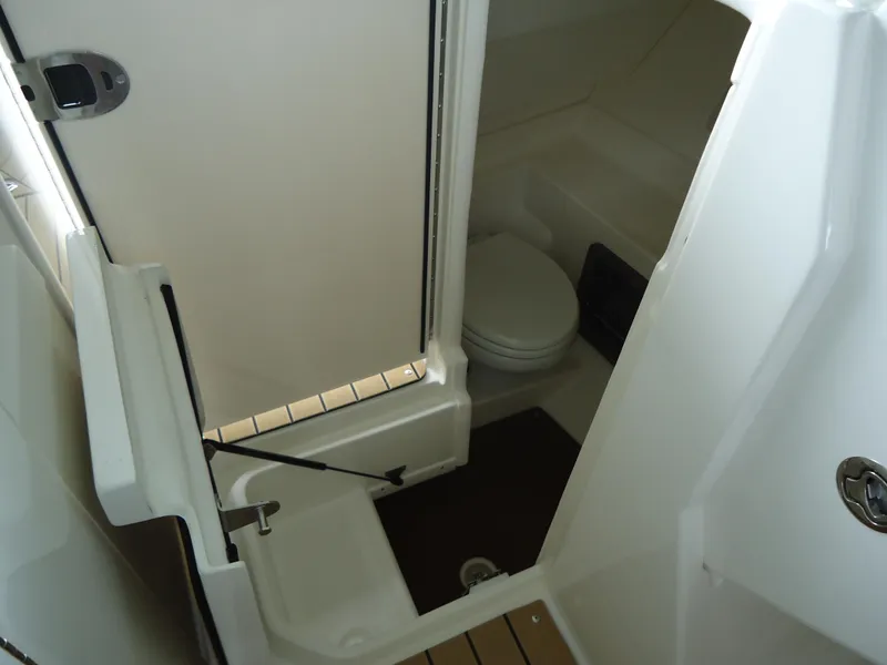 Slide: The Image of Interior bathroom of 2022 Sea Ray 350 SLX boat with toilet and shower. - 11