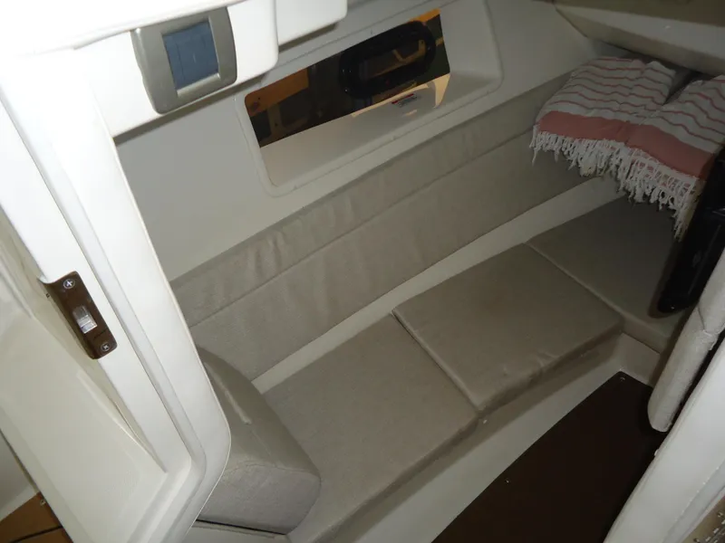Slide: The Image of Interior cabin of 2022 Sea Ray 350 SLX boat with cushioned seating. - 12