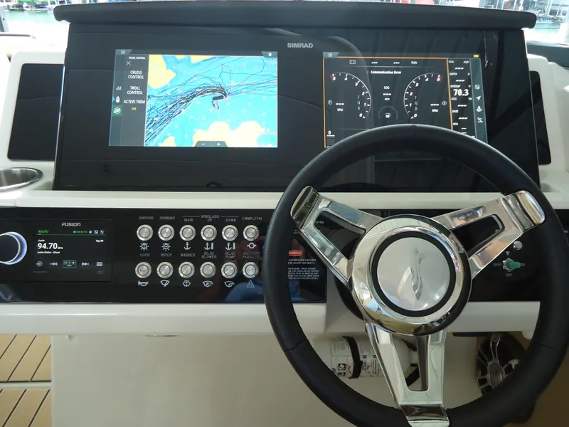 Slide: The Image of 2022 Sea Ray 350 SLX dashboard with navigation and control systems. - 7
