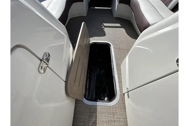 Slide: The Image of 2021 Bennington QX 25 Swingback boat interior storage compartment. - 11