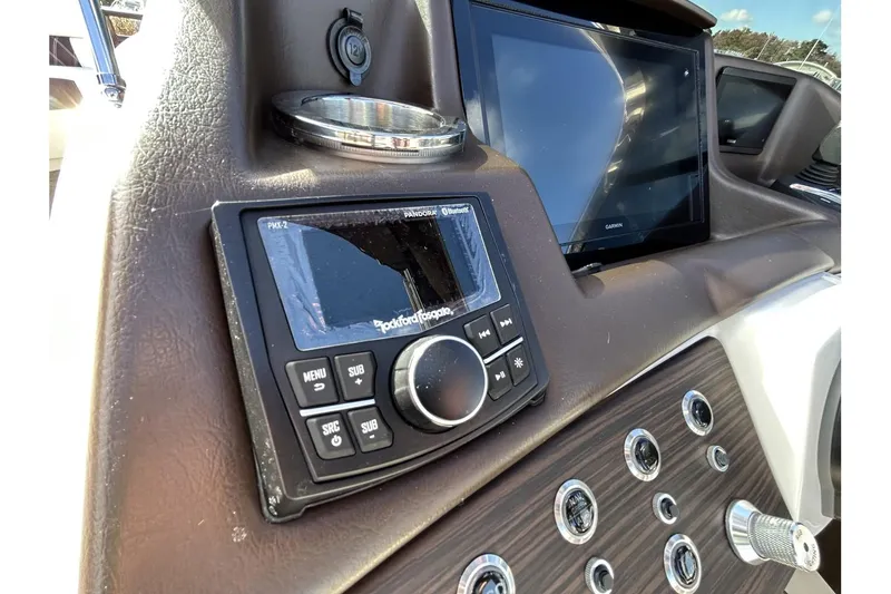 Slide: The Image of 2021 Bennington QX 25 Swingback dashboard with Rockford Fosgate audio system and touchscreen display. - 18