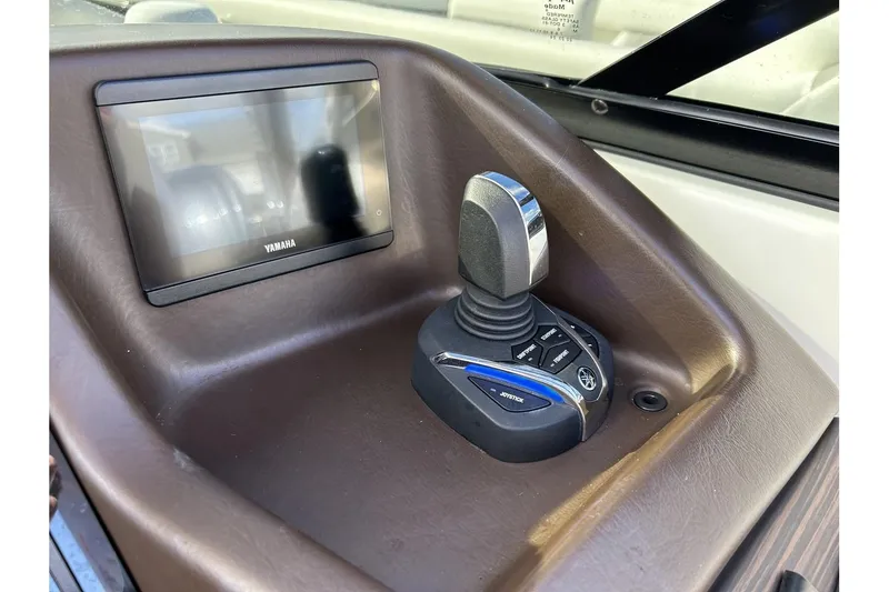 Slide: The Image of 2021 Bennington QX 25 Swingback control panel with Yamaha joystick and display. - 19