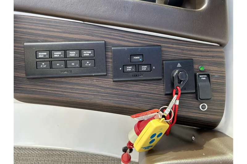 Slide: The Image of Control panel of a 2021 Bennington QX 25 Swingback boat with ignition keys. - 23
