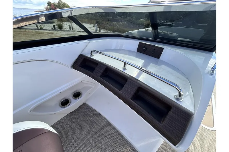 Slide: The Image of Interior view of 2021 Bennington QX 25 Swingback boat with storage compartments. - 27