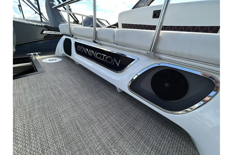 Slide: The Image of 2021 Bennington QX 25 Swingback boat interior with speakers and seating. - 35