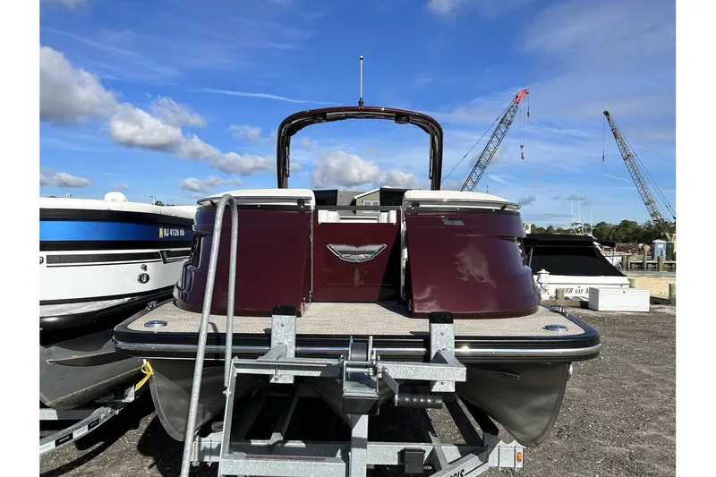Slide: The Image of 2021 Bennington QX 25 Swingback pontoon boat on trailer, rear view. - 5
