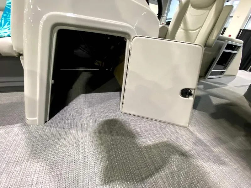 Slide: The Image of Open storage compartment on 2024 SunChaser Geneva 24 SB DH pontoon boat. - 16