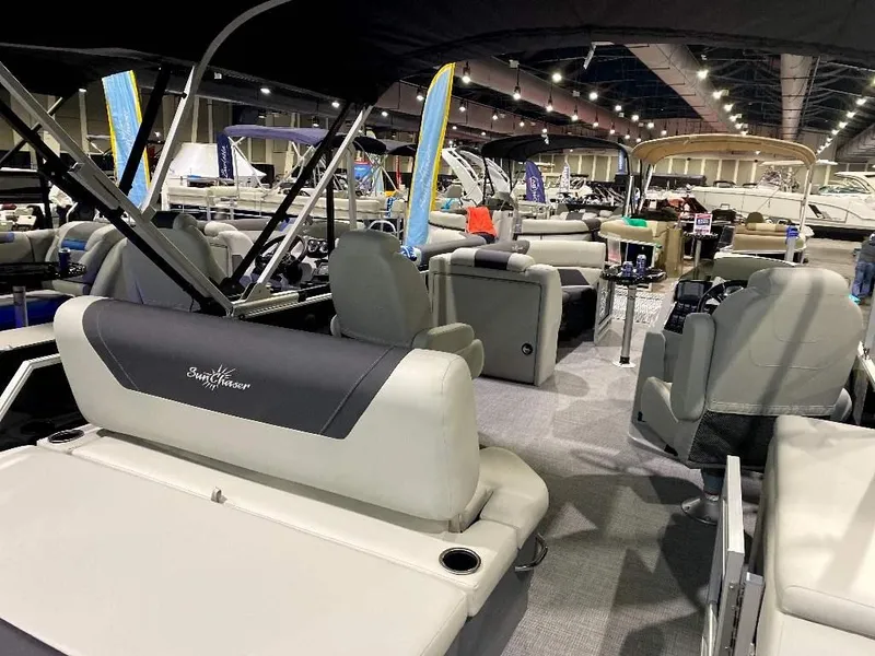 Slide: The Image of 2024 SunChaser Geneva 24 SB DH pontoon boat interior at a boat show. - 4