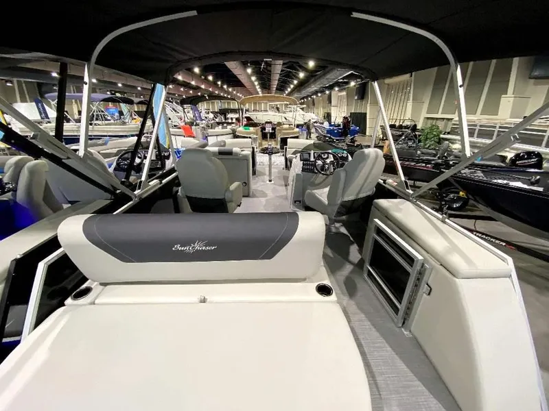 Slide: The Image of 2024 SunChaser Geneva 24 SB DH pontoon boat interior at a boat show. - 7