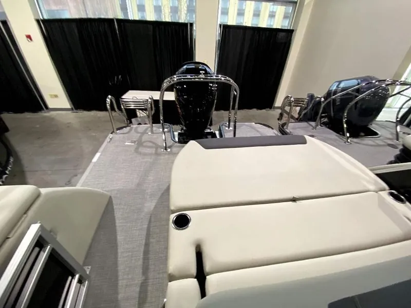 Slide: The Image of 2024 SunChaser Geneva 24 SB DH pontoon boat interior with helm and seating. - 9