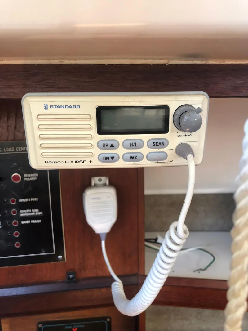 Slide: The Image of VHF radio on 1983 Hunter 34 sailboat, featuring Standard Horizon Eclipse model. - 27