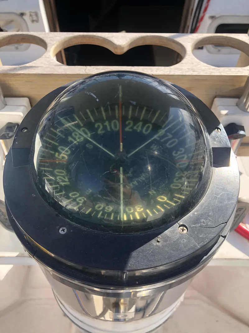 Slide: The Image of Close-up of a compass on a 1983 Hunter 34 sailboat. - 29