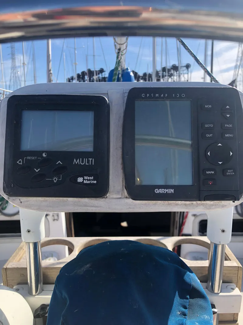 Slide: The Image of Sailing instruments on a 1983 Hunter 34 yacht, featuring West Marine and Garmin displays. - 30