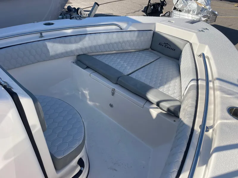 Slide: The Image of 2024 Sea Chaser 20 HFC boat interior with cushioned seating and storage. - 6