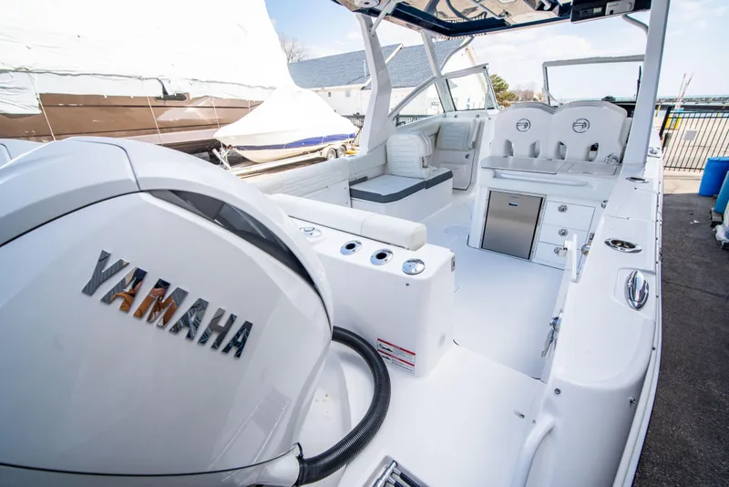 Slide: The Image of 2024 Edgewater 262 CX boat interior with Yamaha engine. - 8