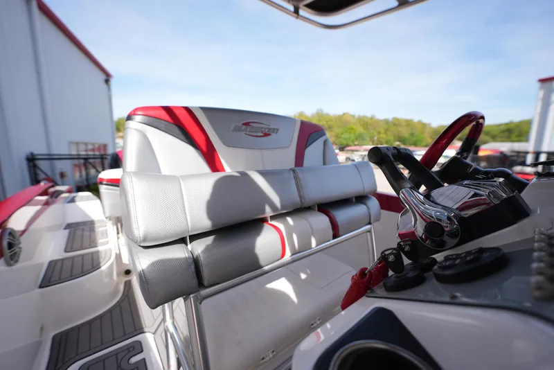 Slide: The Image of 2016 Sunsation 29 CCX boat interior with steering wheel and seating. - 14