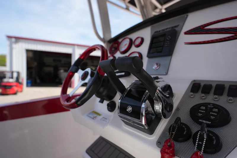 Slide: The Image of Close-up of 2016 Sunsation 29 CCX boat controls and steering wheel. - 15