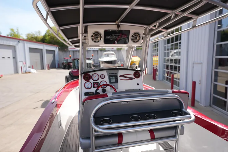 Slide: The Image of 2016 Sunsation 29 CCX boat cockpit with control panel and seating. - 17