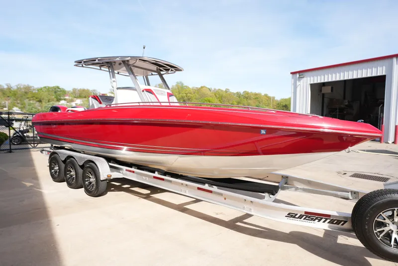 Slide: The Image of 2016 Sunsation 29 CCX red boat on a trailer. - 3