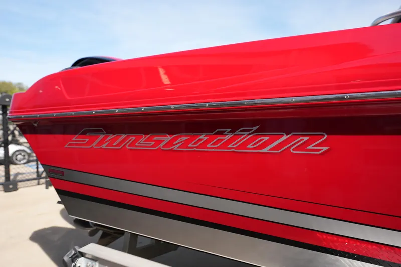 Slide: The Image of 2016 Sunsation 29 CCX boat, red exterior with logo. - 4