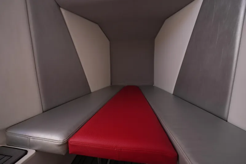 Slide: The Image of Interior cabin of 2016 Sunsation 29 CCX boat with red and gray seating. - 7