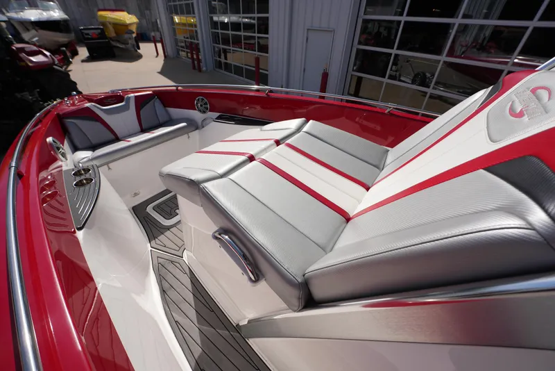 Slide: The Image of 2016 Sunsation 29 CCX boat interior with red and gray seating. - 9