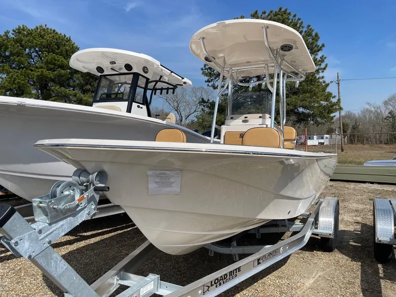 Slide: The Image of 2024 Carolina Skiff 24 Ultra Elite boat on a trailer, ready for transport. - 2