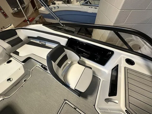 Slide: The Image of 2024 Yamaha Boats SX195 interior cockpit with seating and control panel. - 11