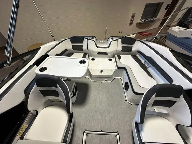 Slide: The Image of 2024 Yamaha Boats SX195 interior with seating and table. - 12