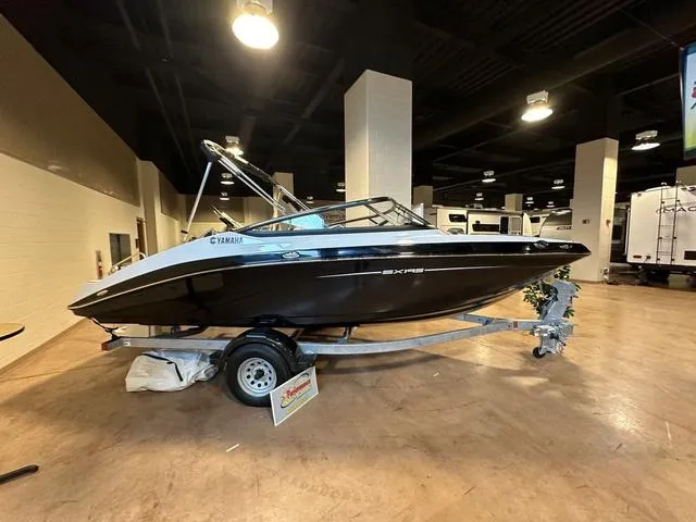 Slide: The Image of 2024 Yamaha Boats SX195 on display indoors. - 3