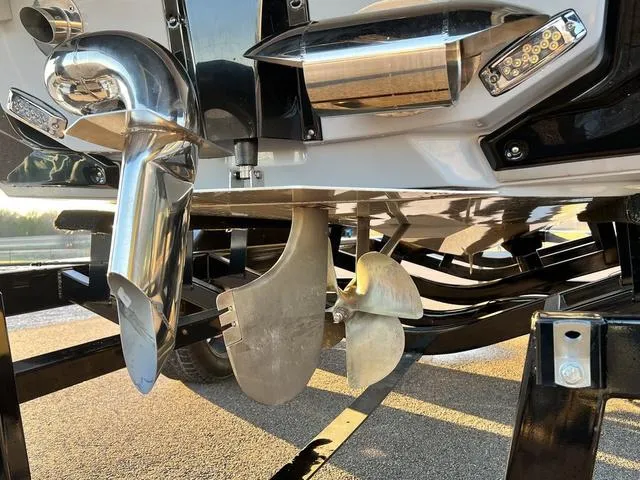 Slide: The Image of Close-up of 2022 Nautique G23 boat propeller and exhaust system. - 10
