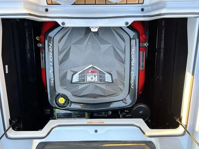 Slide: The Image of 2022 Nautique G23 engine compartment with PCM engine cover. - 11